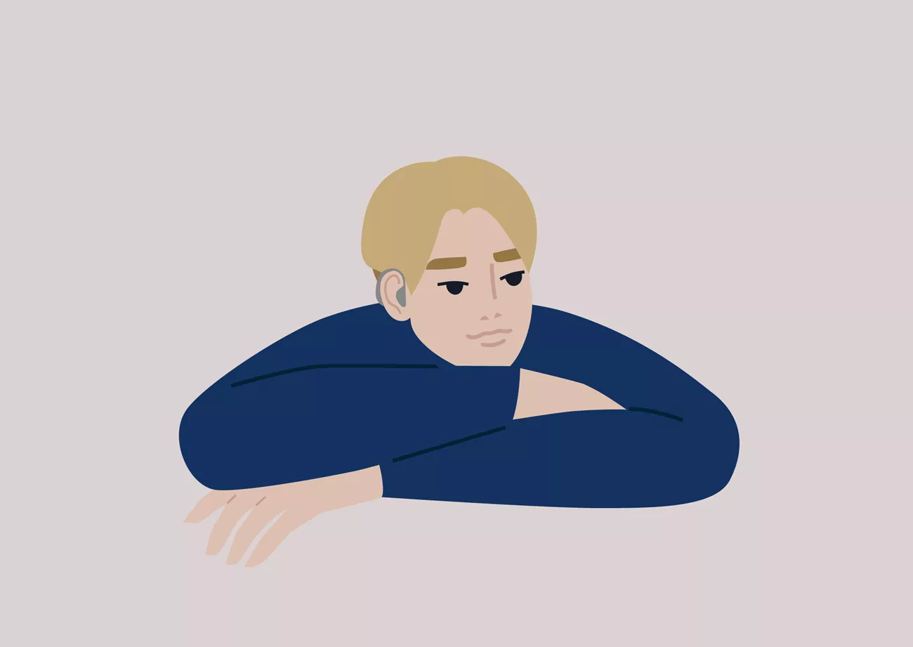 En nedstämd kille med hörapparat.